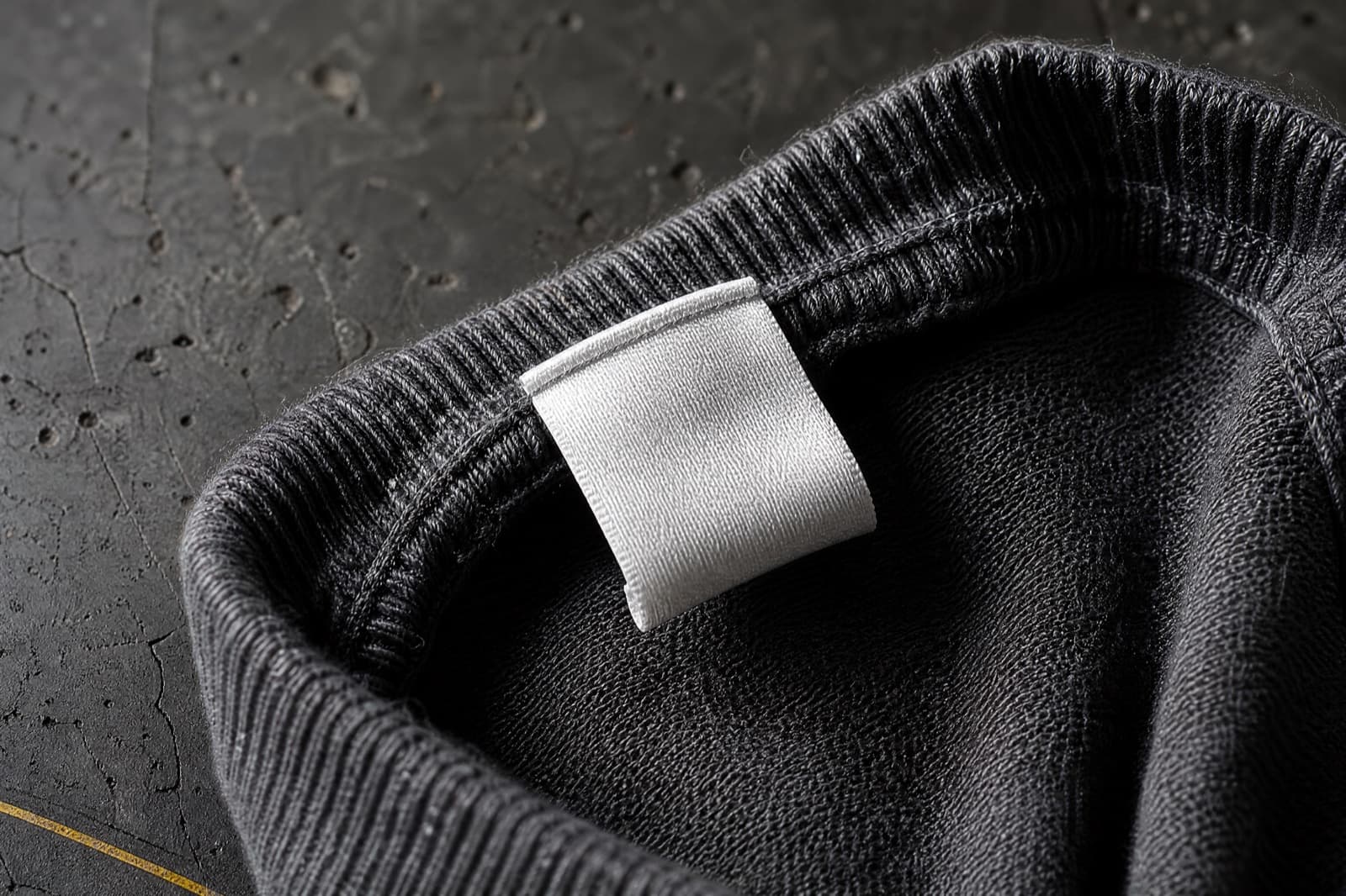 The woven composition and care label stitched inside the cuff